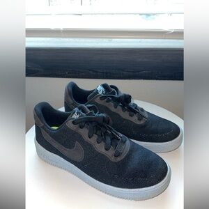 Black and light blue bottom Nike shoes